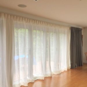What should I do to remove oil stains from drapes?